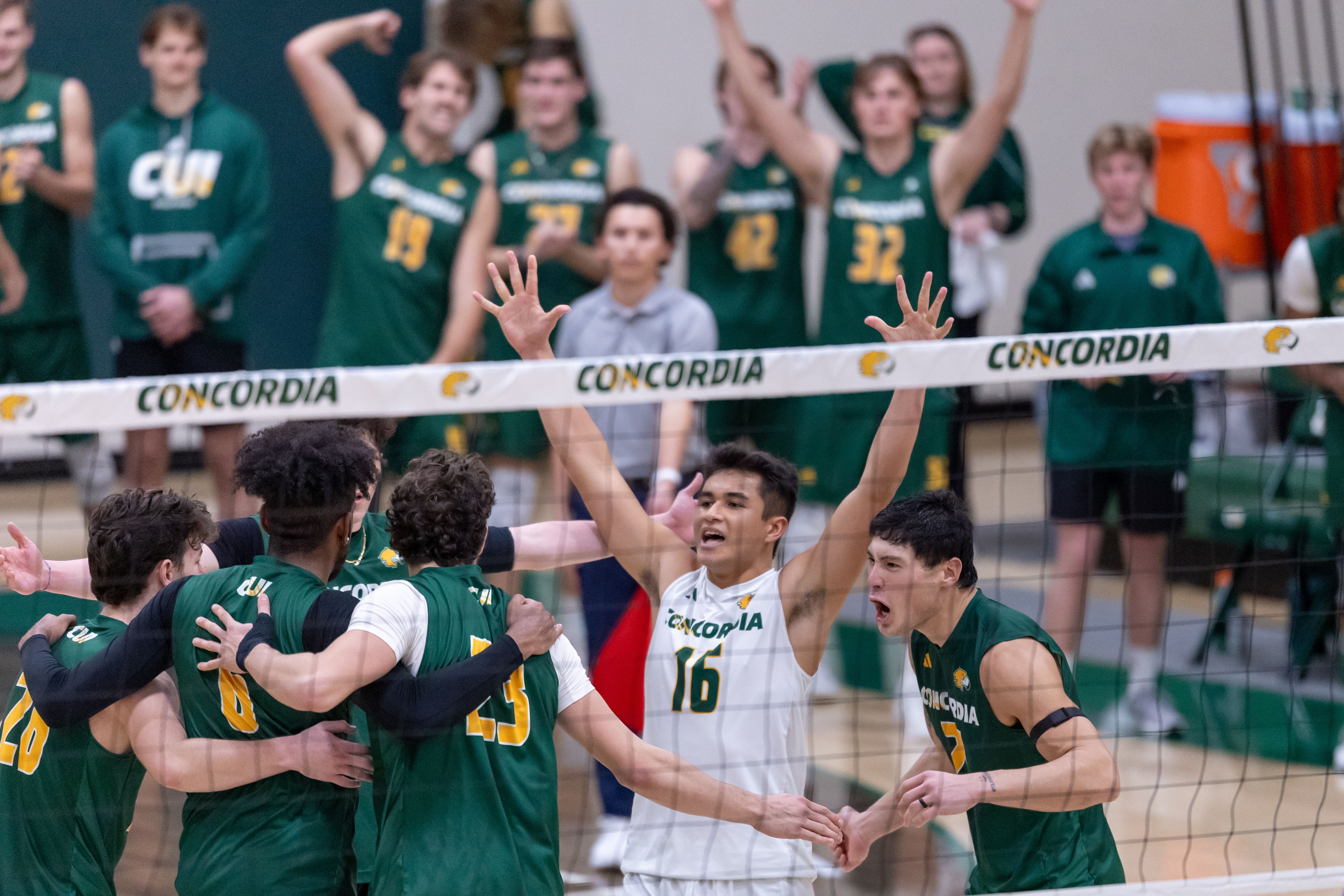 Libero Cruse Ae’e ( No.16) led the team in celebration after pushing the seventh ranked Brigham Young Cougars to a fifth set Feb 14.